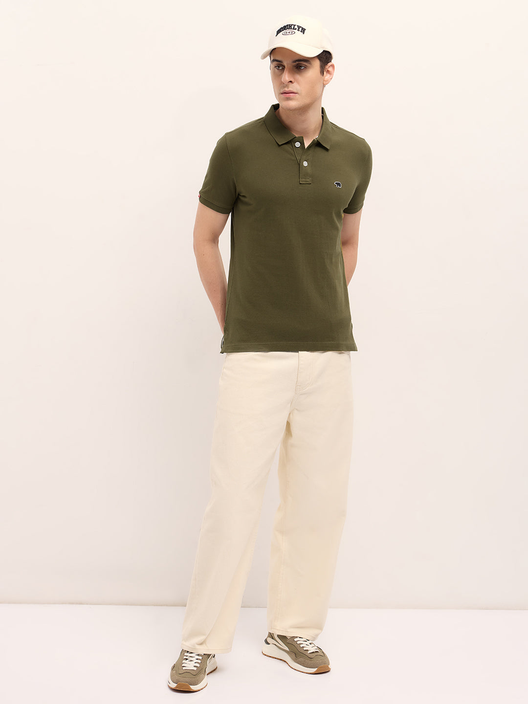 Dark Green Solid Regular Fit Polo with Embroidered Chest Logo