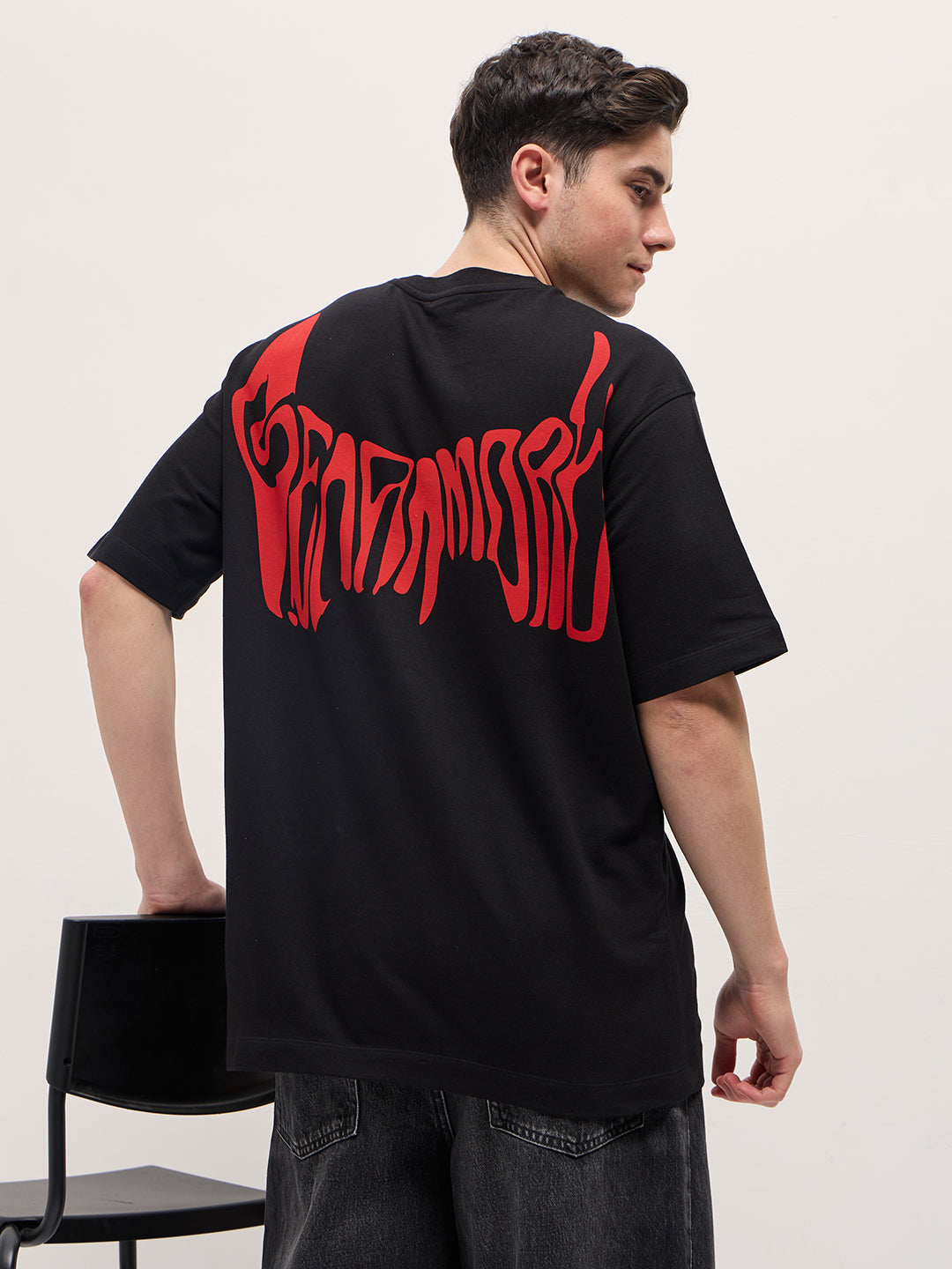 Black Graphic T-Shirt with Bold Red Abstract Design