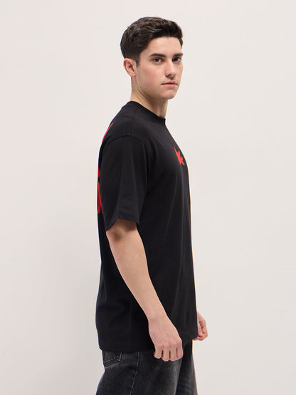 Black Graphic T-Shirt with Bold Red Abstract Design