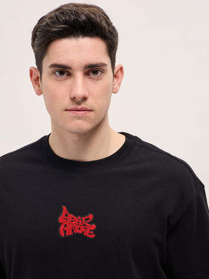 Black Graphic T-Shirt with Bold Red Abstract Design