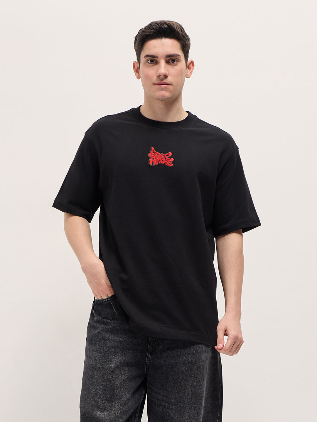 Black Graphic T-Shirt with Bold Red Abstract Design