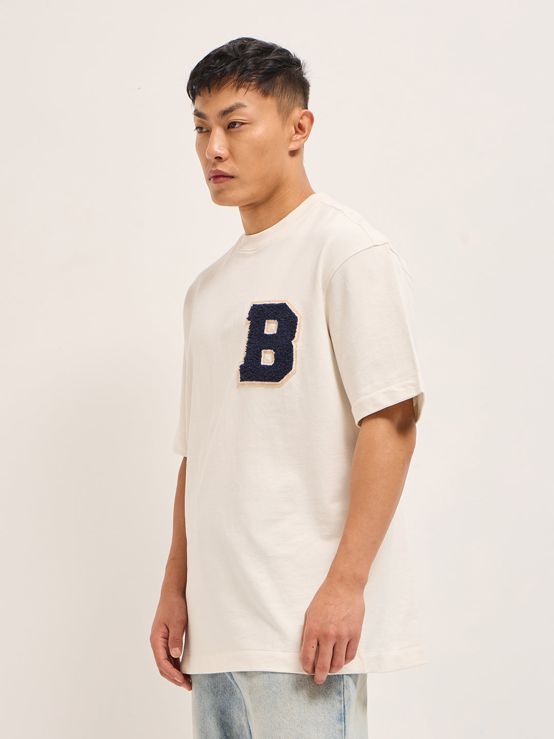 White Oversized Graphic T-Shirt with Chenille Patch and Bold Back Print